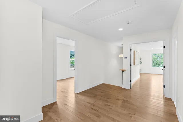 a view of balcony with wooden floor and fence