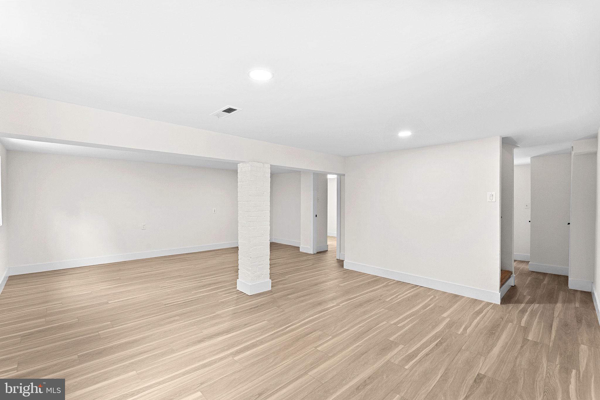 1805 South Pollard Street Arlington, VA 22204 - Photo 49 of 55 a view of an empty room with wooden floor