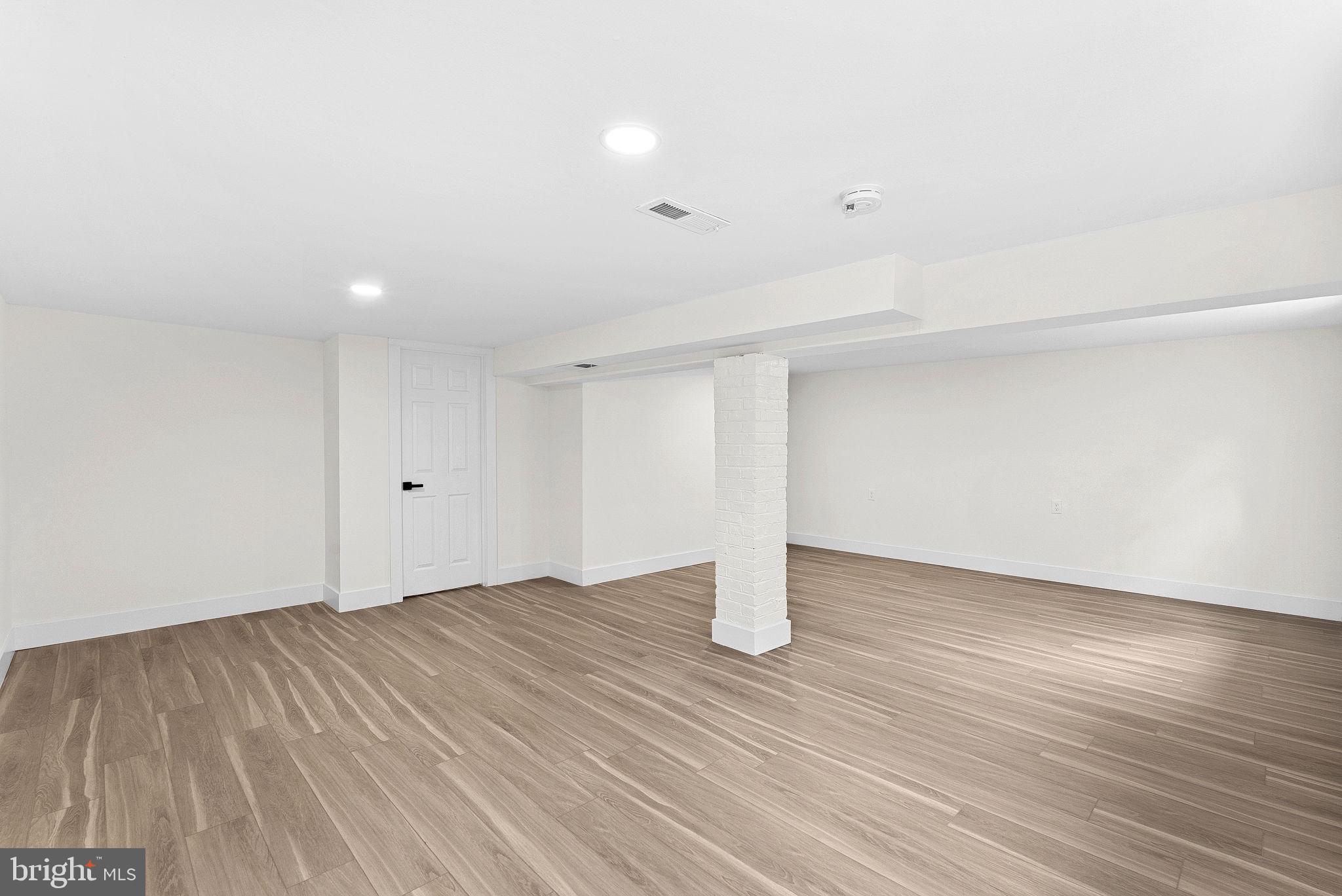 1805 South Pollard Street Arlington, VA 22204 - Photo 50 of 55 a view of an empty room with wooden floor