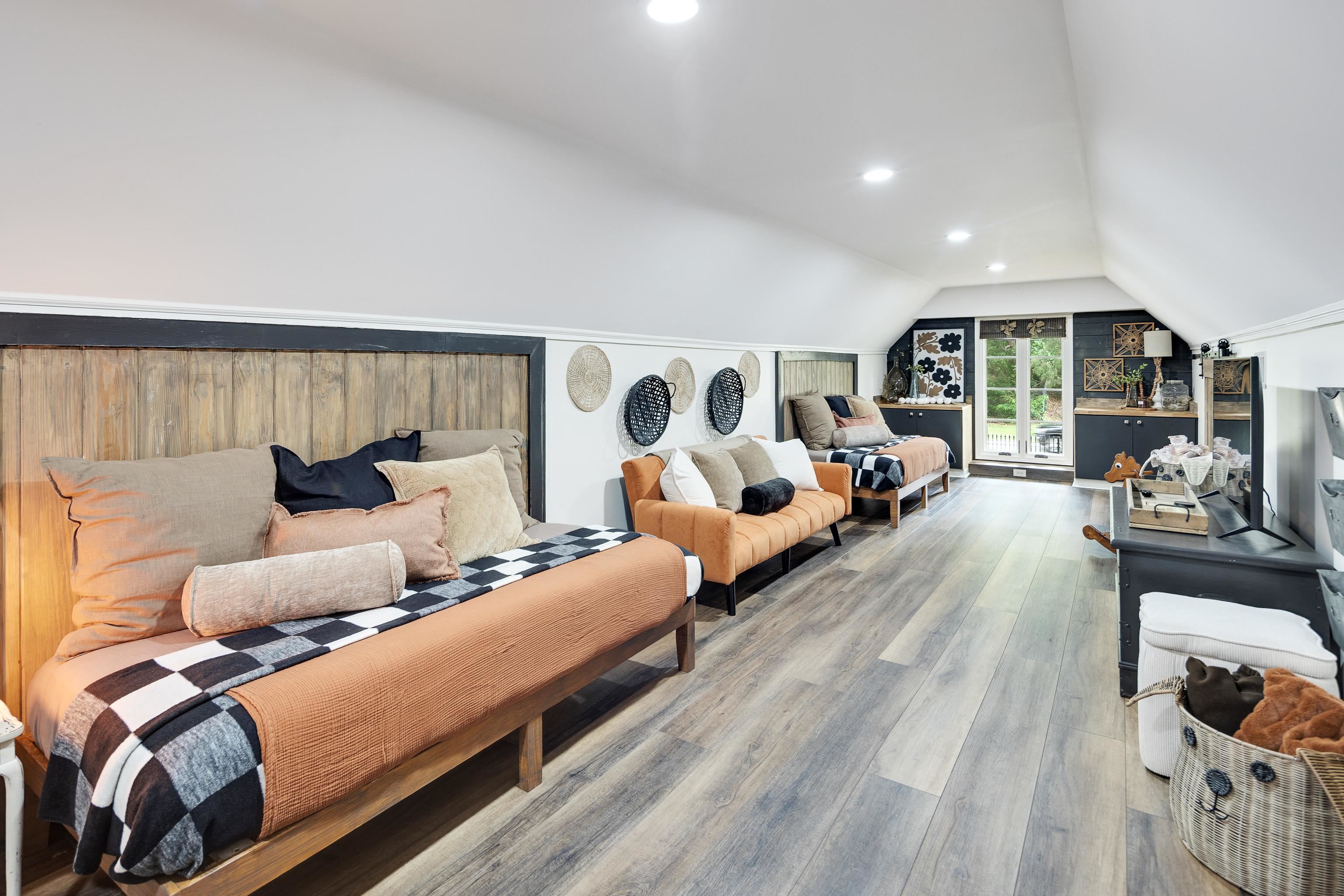 811 Sweetbrier Road Memphis, TN 38120 - Photo 29 of 40 Spacious room with wood-finish flooring, recessed lighting, and sloped ceilings