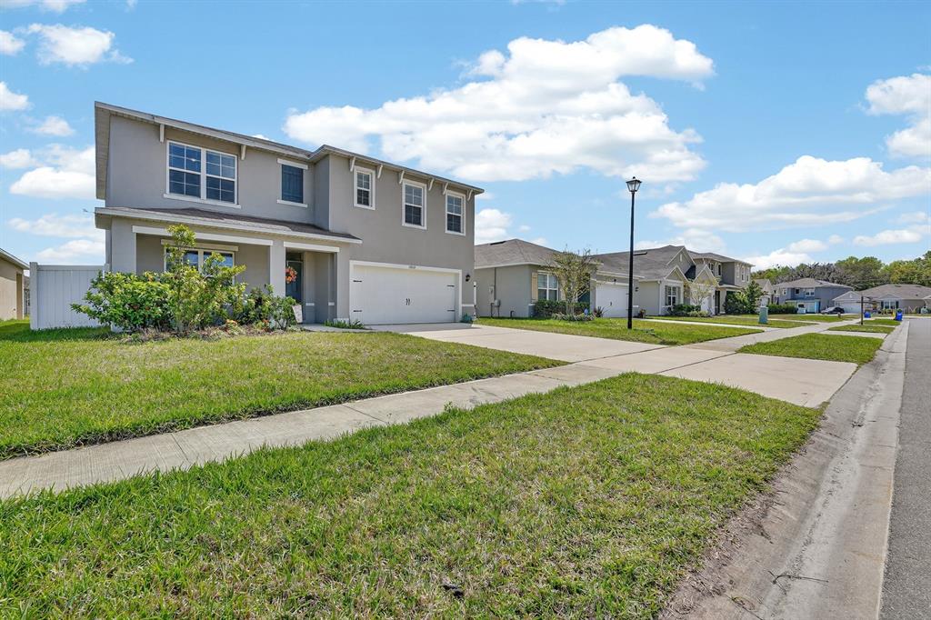 1809 Myrtlebrooke Drive Edgewater, FL 32141 - Photo 41 of 58 a view of a house with a big yard