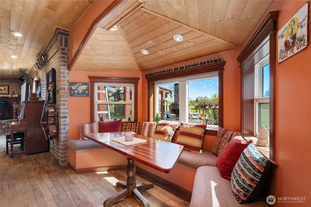 a large bedroom with a bed and a flat screen tv