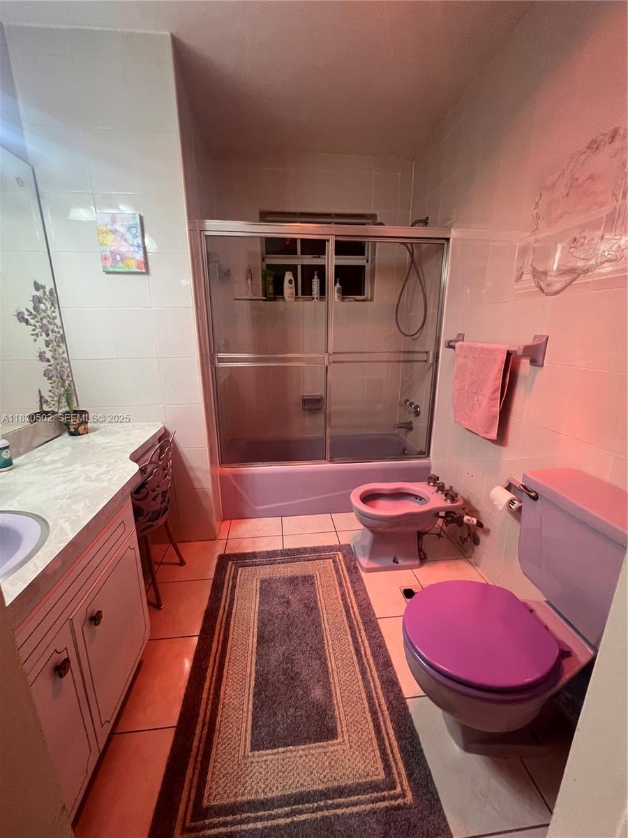 2815 Southwest 36th Avenue Miami, FL 33133 - Photo 15 of 25 a bathroom with a sink and mirror