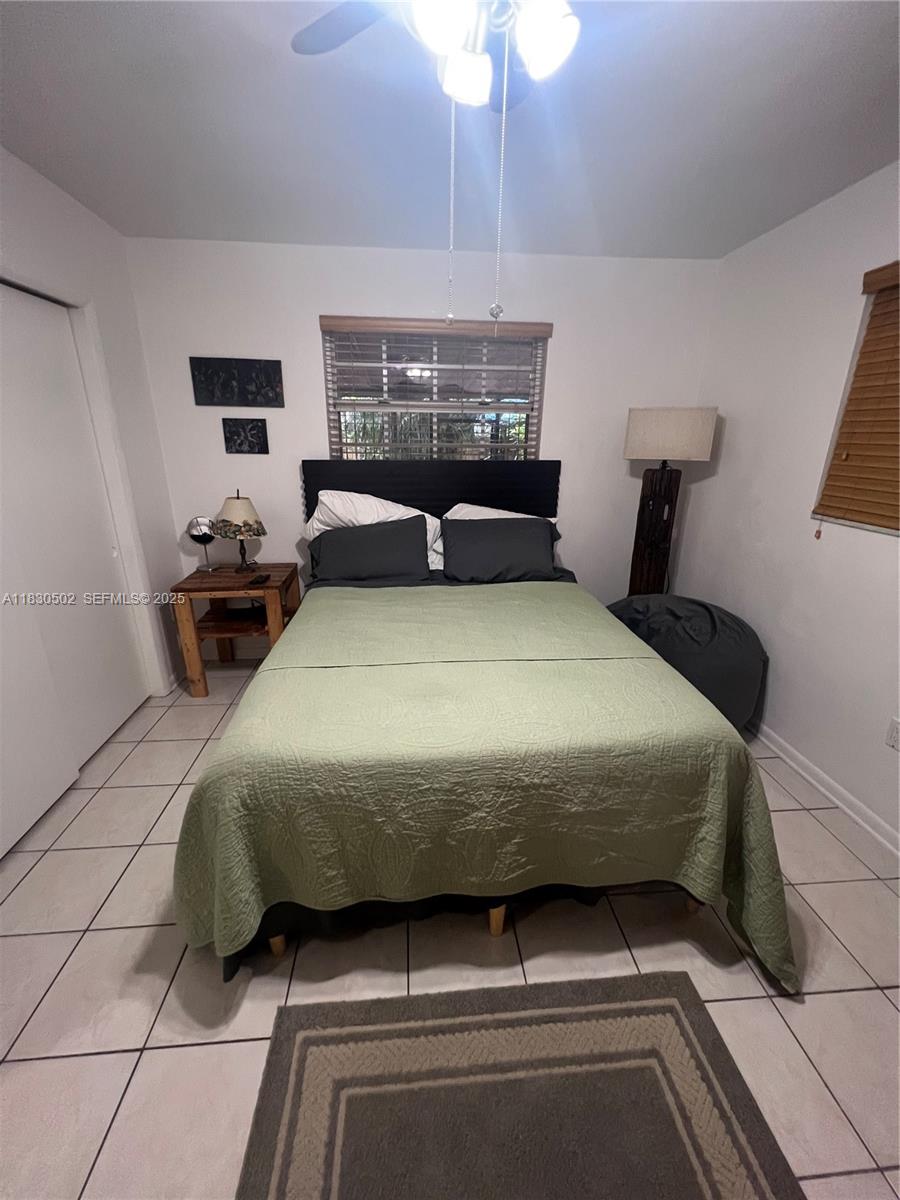 2815 Southwest 36th Avenue Miami, FL 33133 - Photo 17 of 25 a bedroom with a bed and window