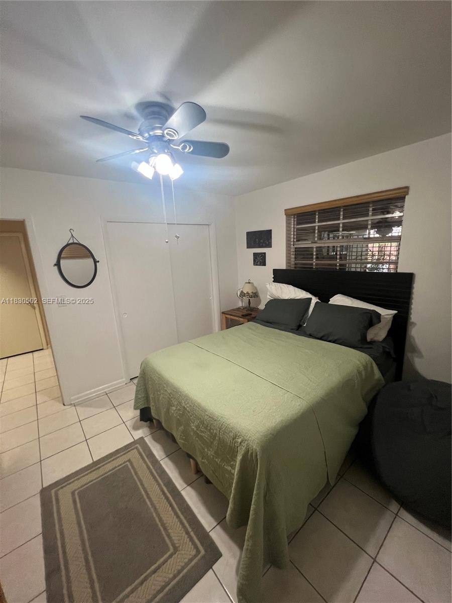 2815 Southwest 36th Avenue Miami, FL 33133 - Photo 18 of 25 a bedroom with a bed and window