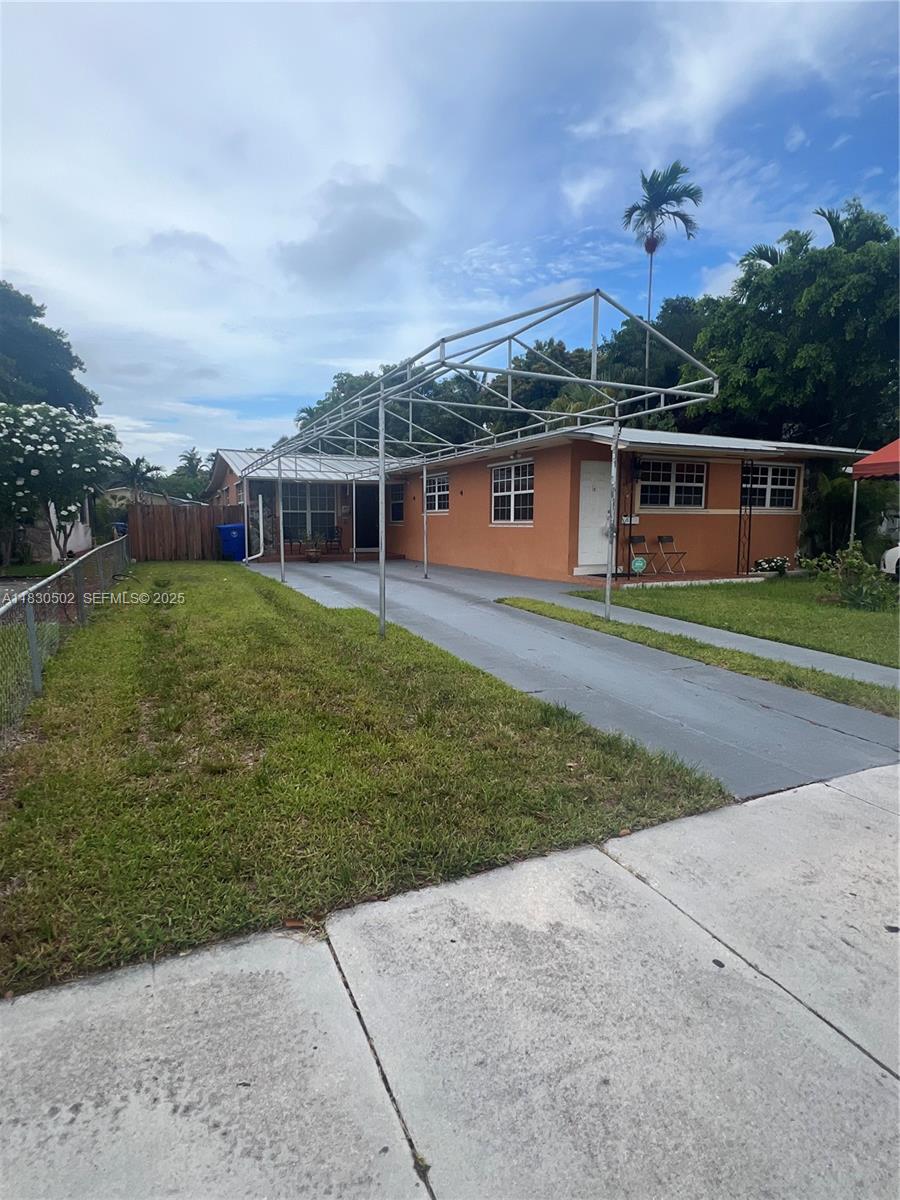 2815 Southwest 36th Avenue Miami, FL 33133 - Photo 2 of 25 front view of a house with a yard