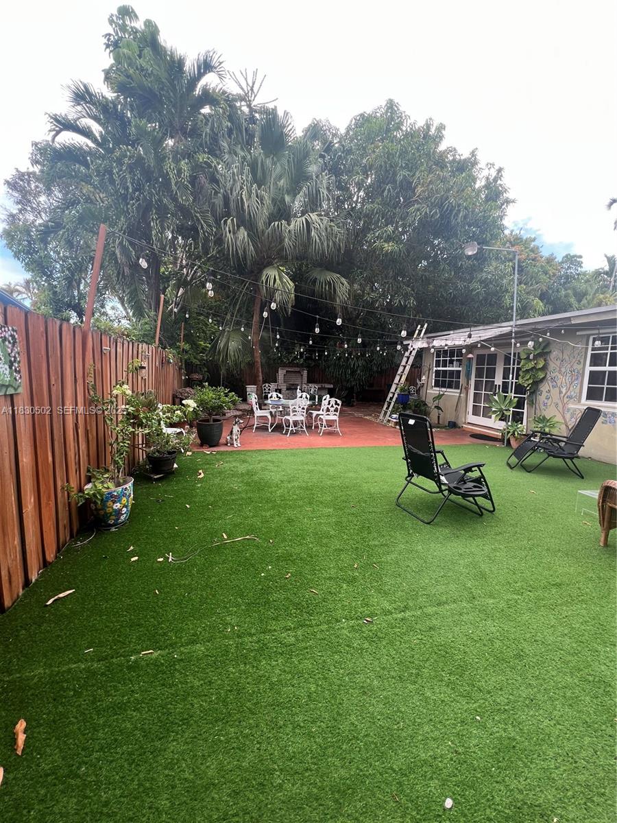 2815 Southwest 36th Avenue Miami, FL 33133 - Photo 25 of 25 a view of a house with backyard and a slide