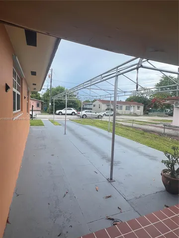 a view of a swimming pool with a porch