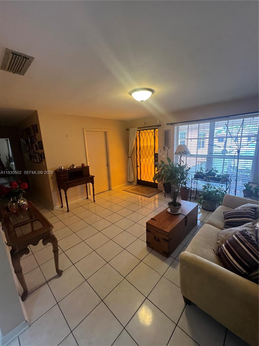 2815 Southwest 36th Avenue Miami, FL 33133 - Photo 7 of 25 a living room with furniture and a window