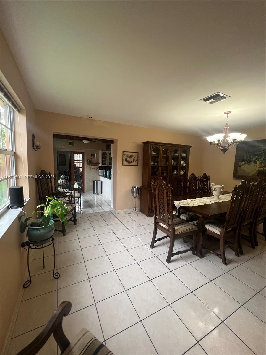 2815 Southwest 36th Avenue Miami, FL 33133 - Photo 8 of 25 a living room with furniture and a potted plant
