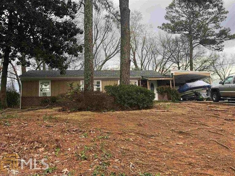 3109 Janice Circle Chamblee, GA 30341 - Photo 1 of 1 a front view of a house with a garden