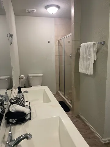 a bedroom with a bed and a table