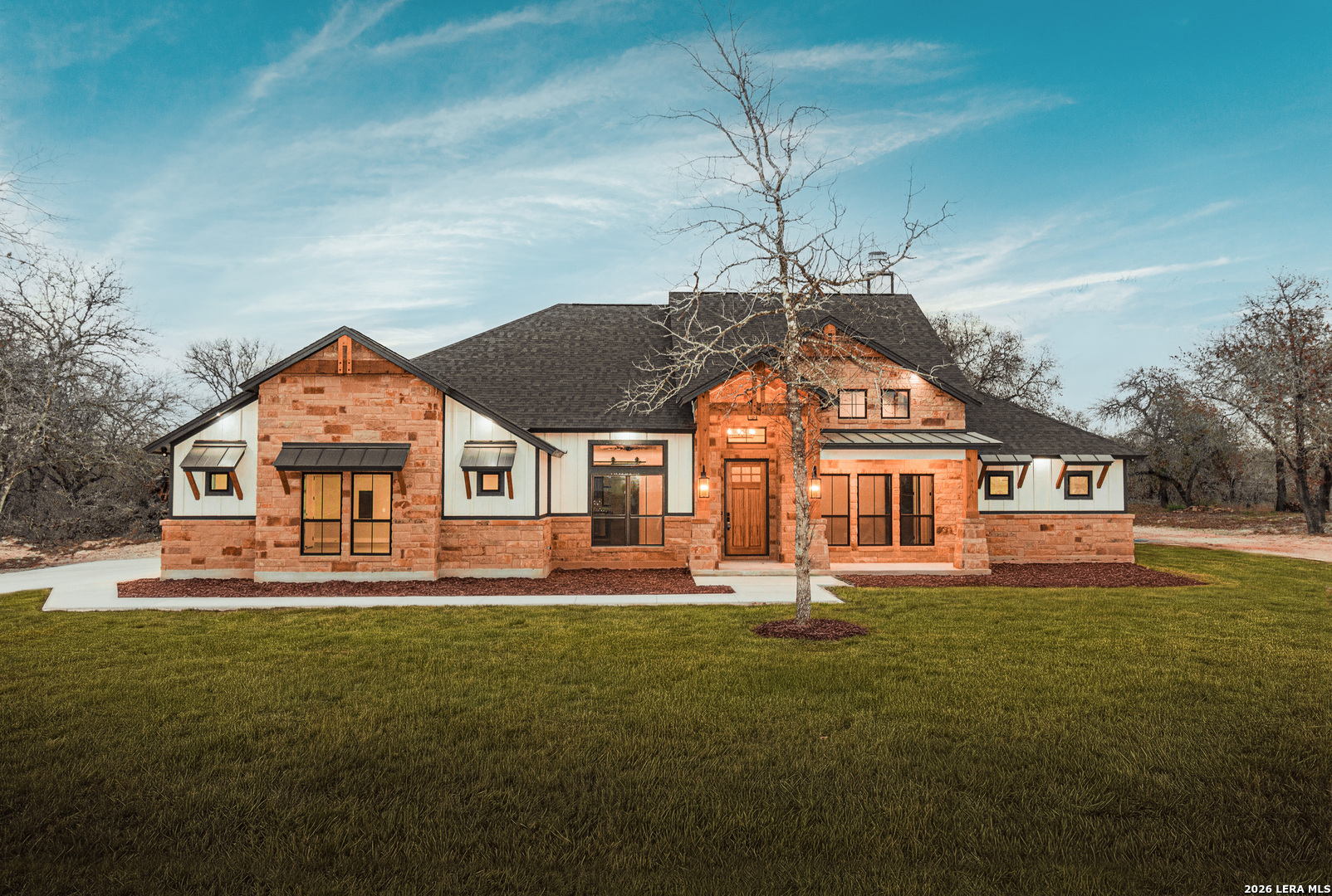 a front view of a house with a yard