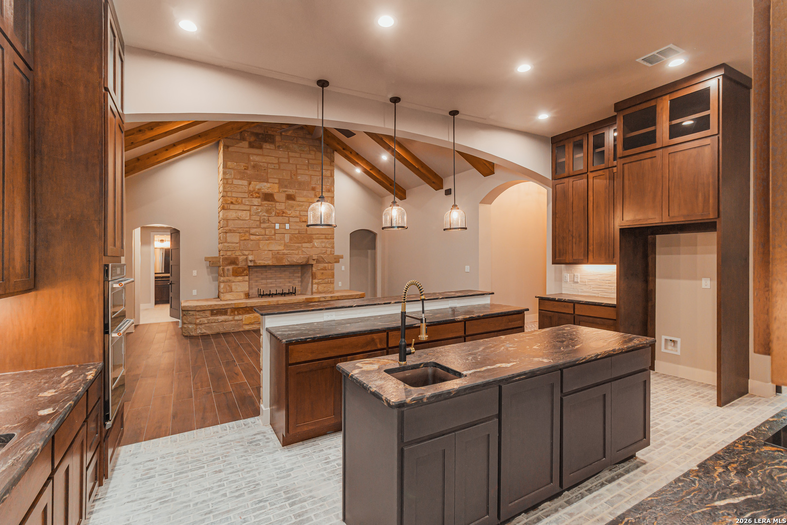 176 Hondo Ridge La Vernia, TX 78121 - Photo 12 of 28 a kitchen that has a sink and a stove in it