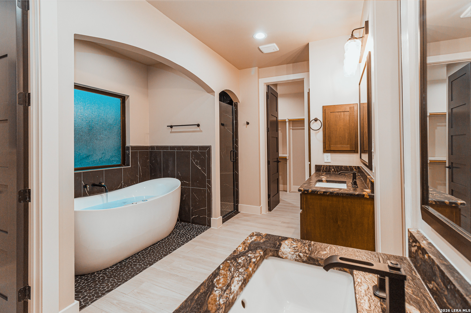 176 Hondo Ridge La Vernia, TX 78121 - Photo 20 of 28 a bathroom with a tub a toilet and a shower