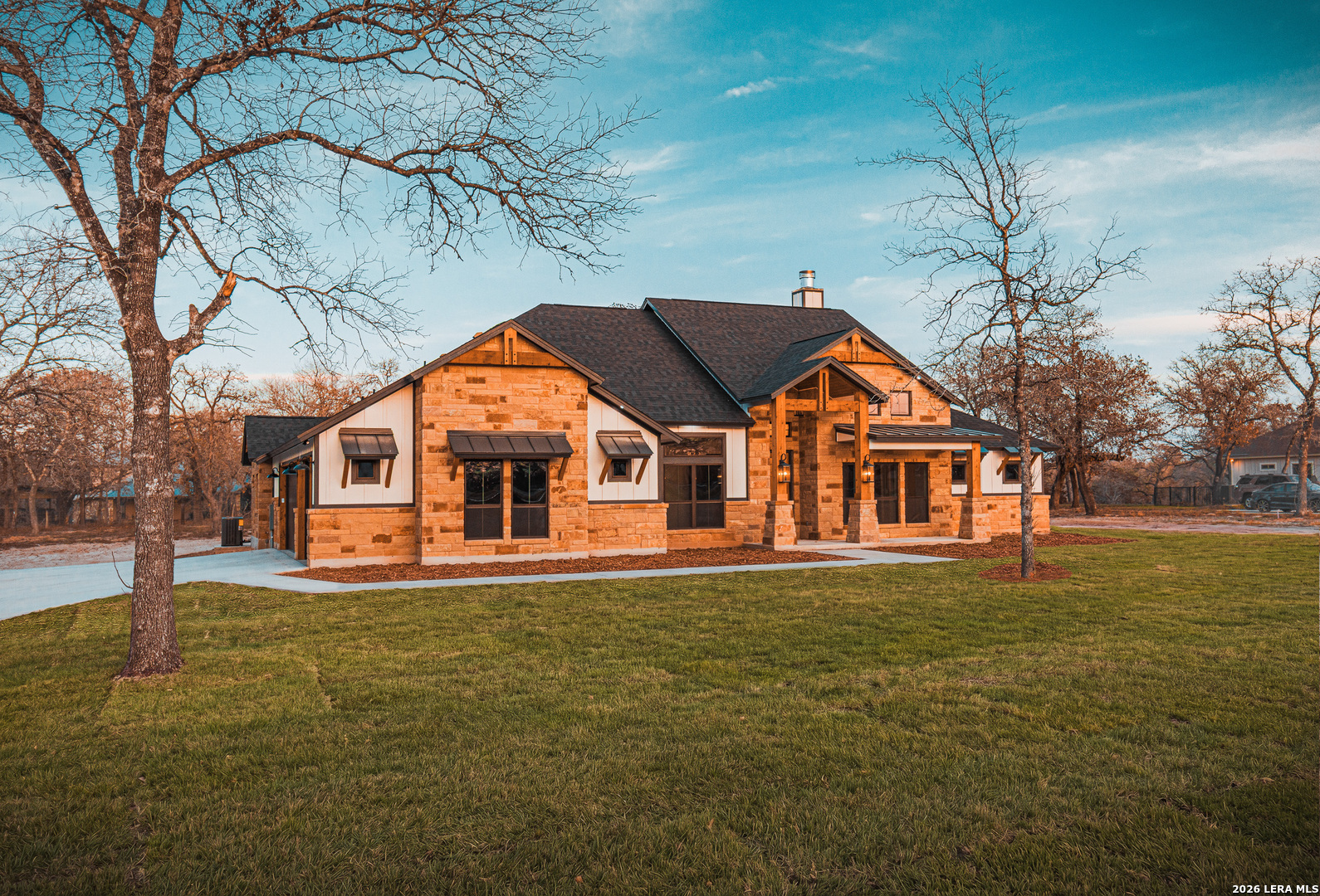 176 Hondo Ridge La Vernia, TX 78121 - Photo 2 of 28 a front view of a house with a yard