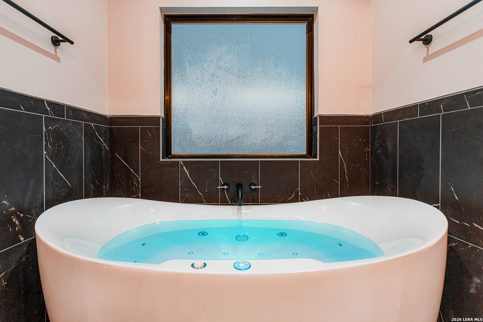 176 Hondo Ridge La Vernia, TX 78121 - Photo 22 of 28 a white bath tub sitting in a bathroom