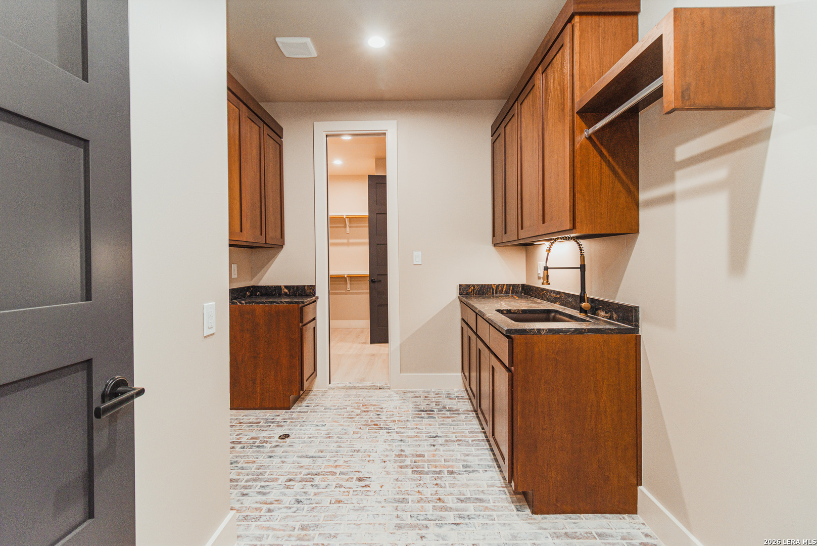 176 Hondo Ridge La Vernia, TX 78121 - Photo 24 of 28 a kitchen with stainless steel appliances granite countertop a refrigerator a sink and a stove