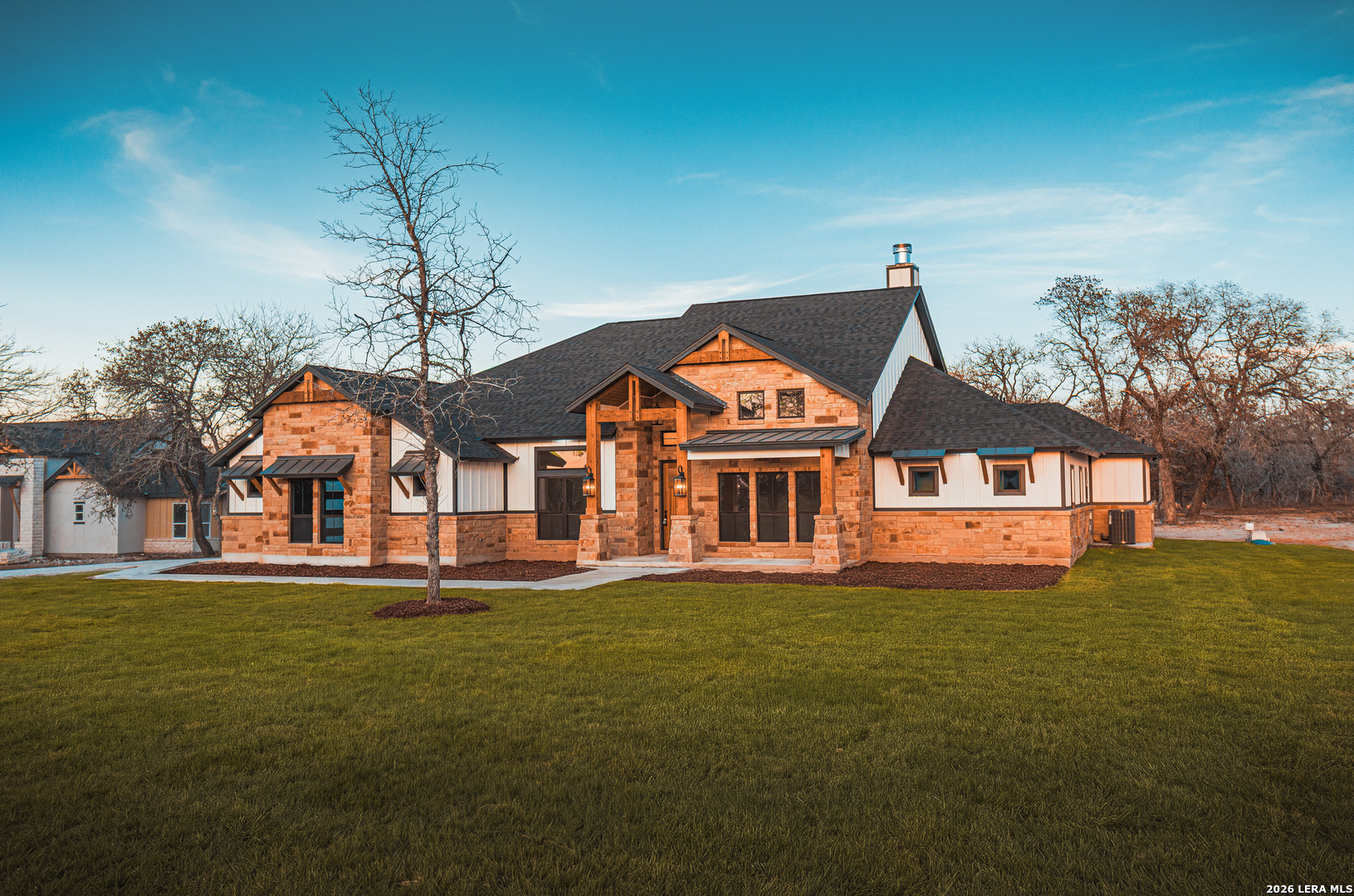 176 Hondo Ridge La Vernia, TX 78121 - Photo 27 of 28 a front view of a house with a yard