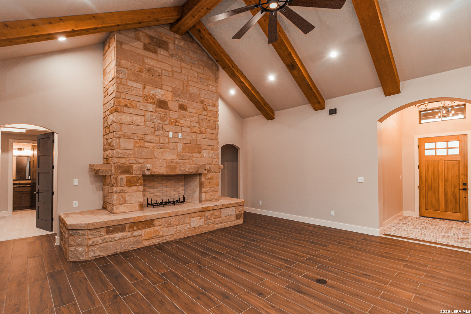 176 Hondo Ridge La Vernia, TX 78121 - Photo 8 of 28 a empty room with wooden floor and windows