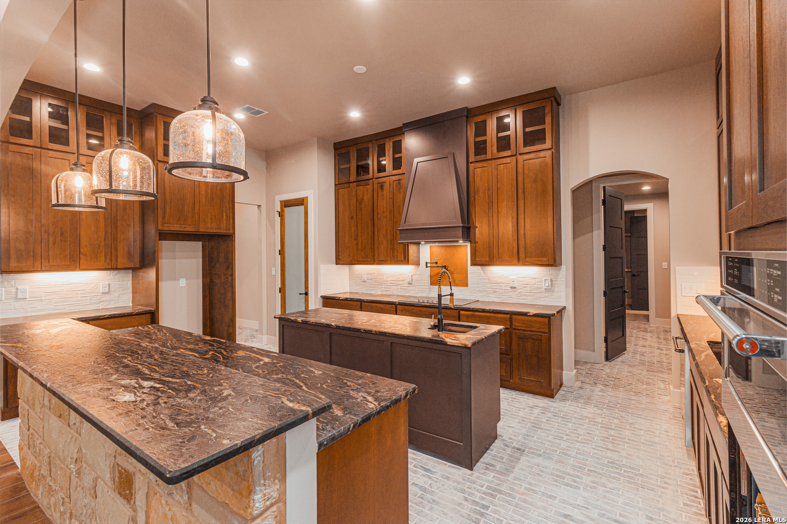 176 Hondo Ridge La Vernia, TX 78121 - Photo 10 of 28 a kitchen with stainless steel appliances granite countertop a sink counter space and cabinets