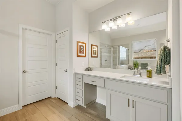 a bathroom with a sink a mirror and a bathtub