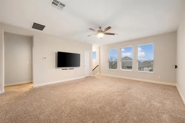 a spacious bathroom with a double vanity sink a mirror and a shower