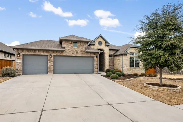 a front view of a house with yard