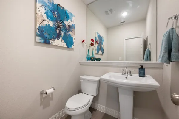 a bathroom with a bathtub a sink and a mirror