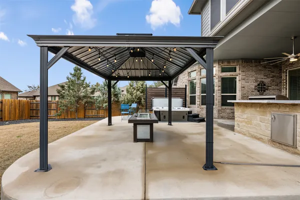 a view of a backyard with sitting area