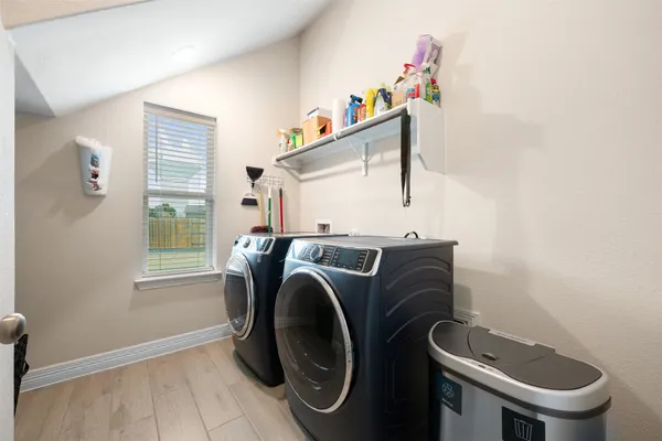 a view of a patio with a table and chairs