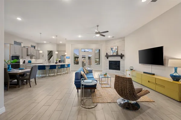 a living room with furniture and a flat screen tv