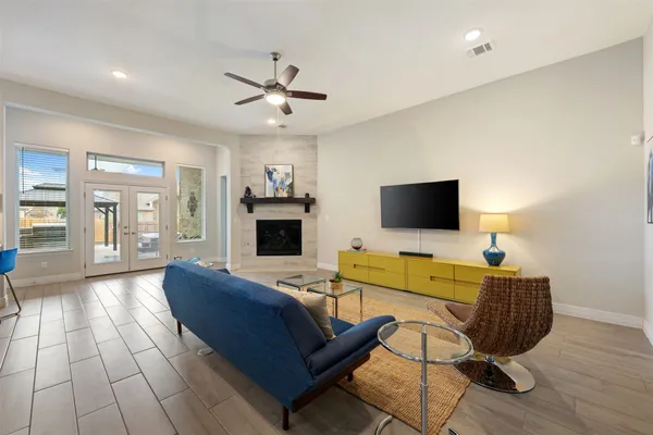 a living room with furniture and a flat screen tv