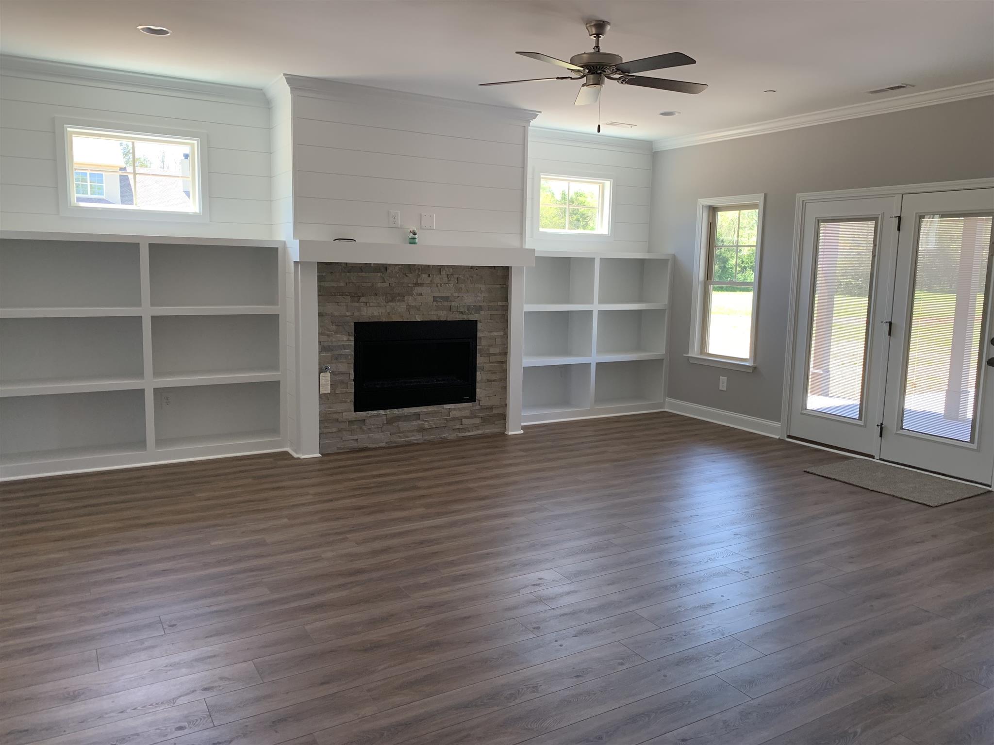 9993 McKee Road Lascassas, TN 37085 - Photo 9 of 30 Lingual fireplace with shiplap and stone surround.