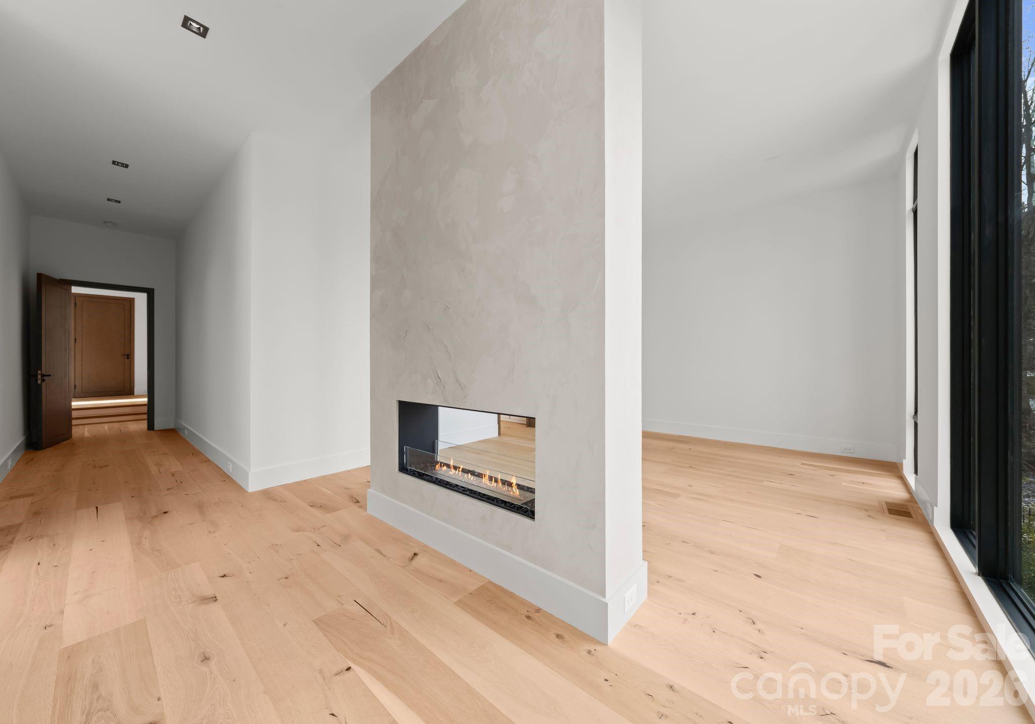 2536 Brawley School Road Mooresville, NC 28117 - Photo 19 of 48 a view of an empty room with wooden floor and a window