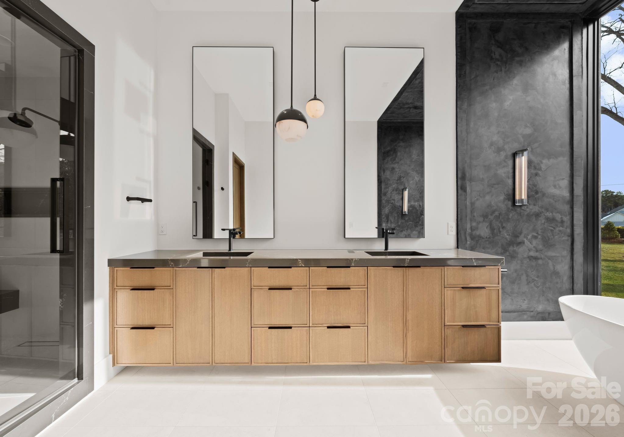 2536 Brawley School Road Mooresville, NC 28117 - Photo 23 of 48 a bathroom with a granite countertop double vanity sink and a mirror