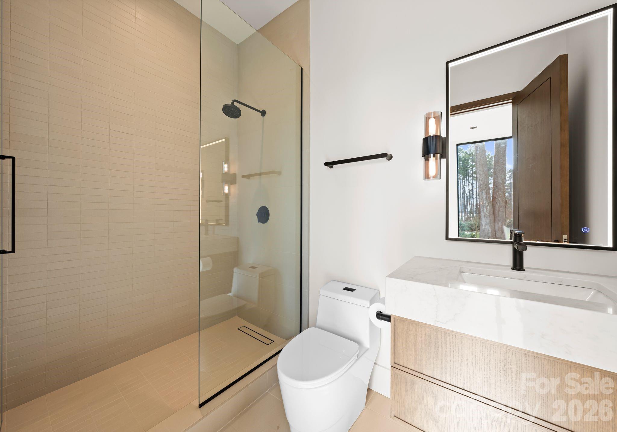 2536 Brawley School Road Mooresville, NC 28117 - Photo 27 of 48 a bathroom with a sink toilet and shower