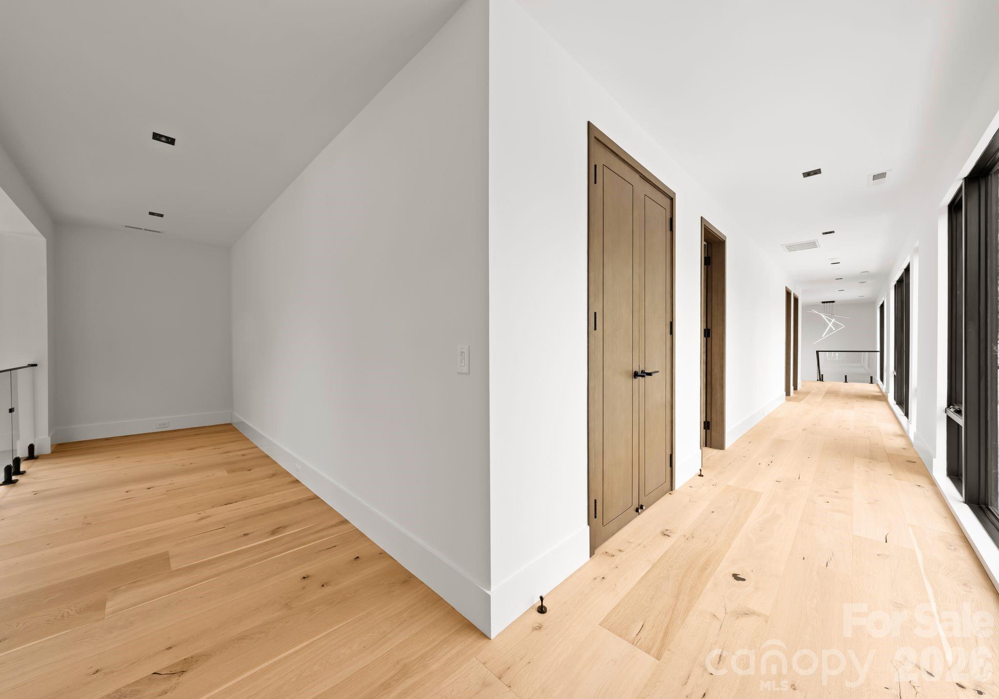 2536 Brawley School Road Mooresville, NC 28117 - Photo 36 of 48 a view of hallway with wooden floor