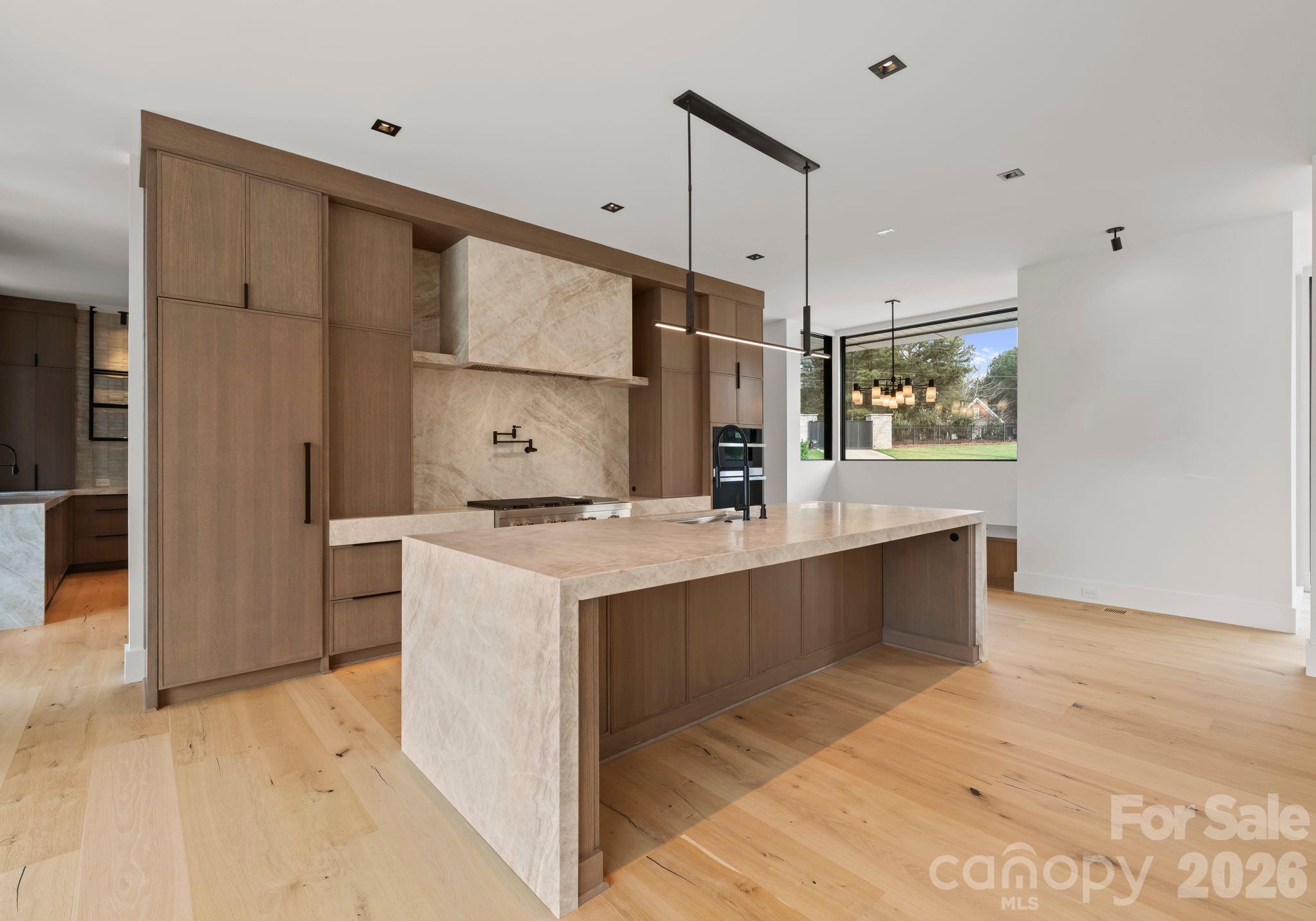 2536 Brawley School Road Mooresville, NC 28117 - Photo 9 of 48 a kitchen with a sink and refrigerator