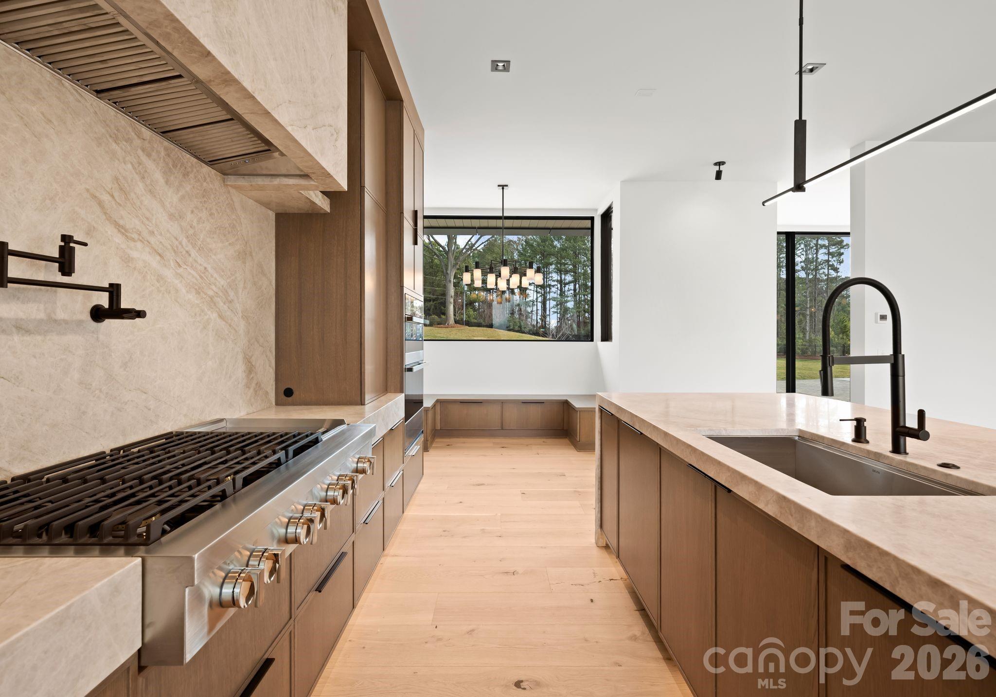 2536 Brawley School Road Mooresville, NC 28117 - Photo 10 of 48 a kitchen with granite countertop a stove and a sink