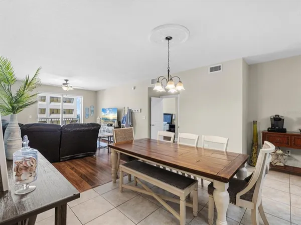 a bedroom with a bed and a flat tv screen on dresser