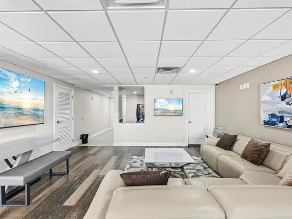 a view of a chairs and table in patio with a backyard