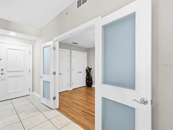 a kitchen with a sink a counter space appliances and cabinets