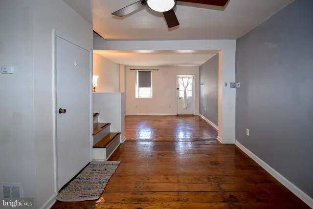 a view of gallery with wooden floor