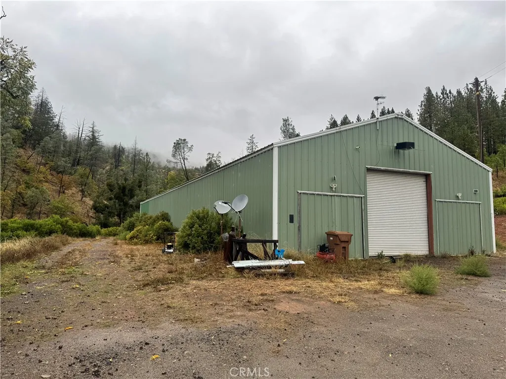 21575 My Middletown, CA 95461 - Photo 2 of 12 a backyard of a house with potted plants and large tree