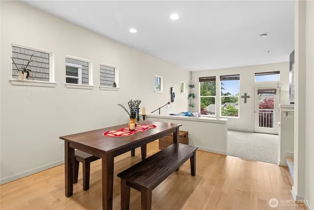 a view of a dining room with furniture and window