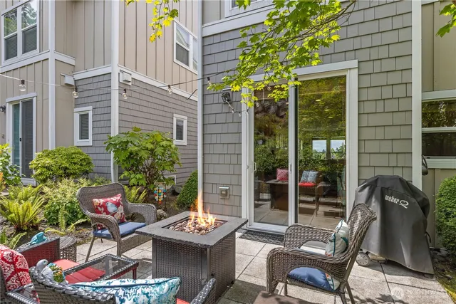 a backyard of a house with outdoor seating