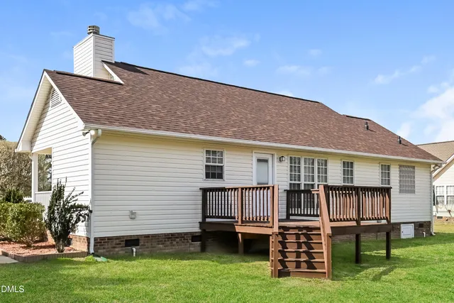 a backyard of a house with a deck
