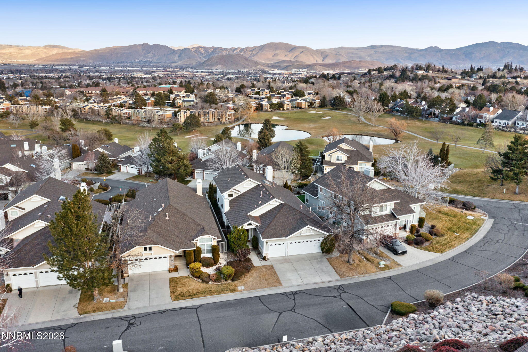 6186 Squires Lane Reno, NV 89519 - Photo 57 of 57 an aerial view of a house with a lake view