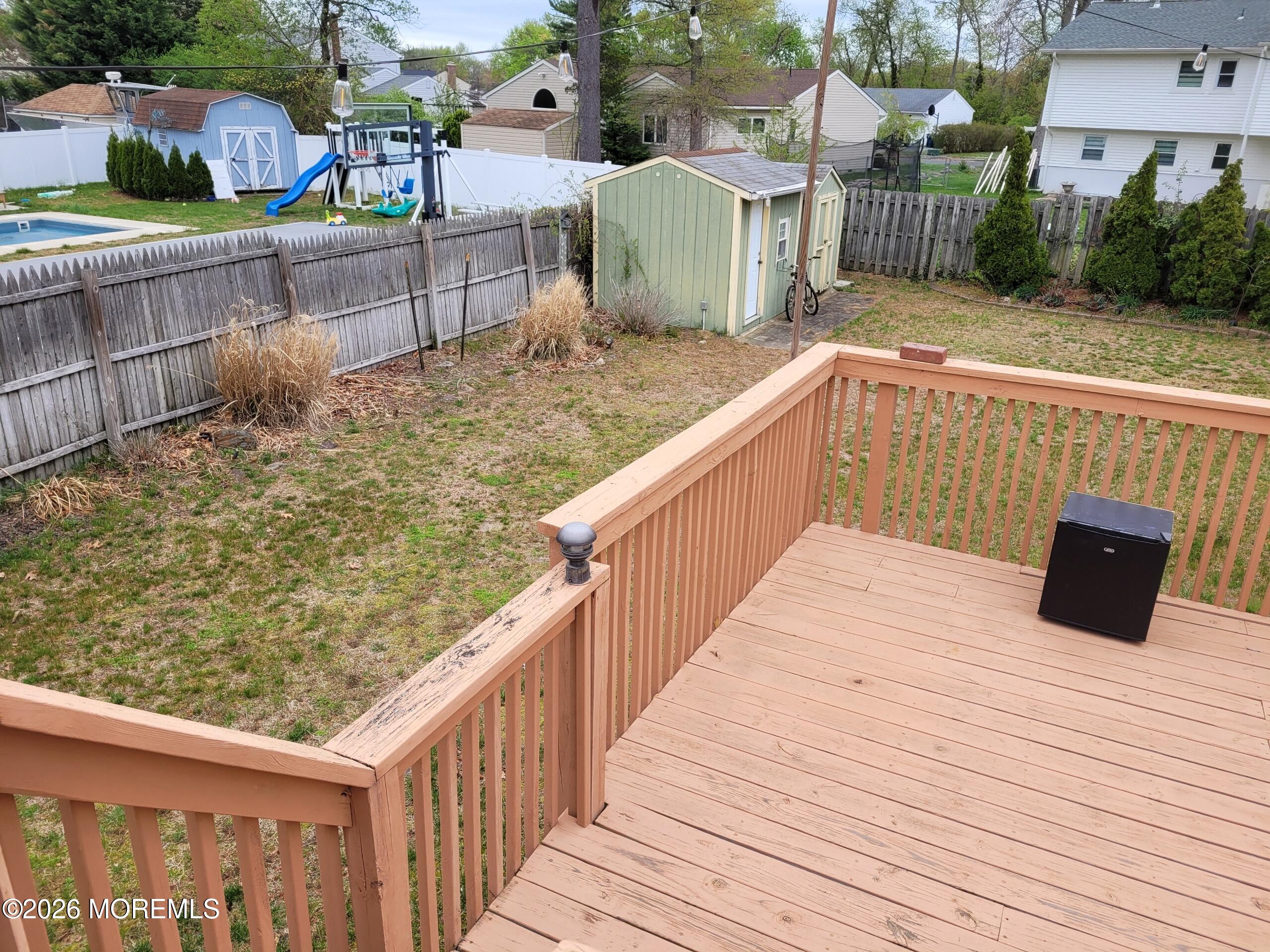 5 Peach Tree Road Oakhurst, NJ 07755 - Photo 6 of 6 a view of a balcony with wooden floor